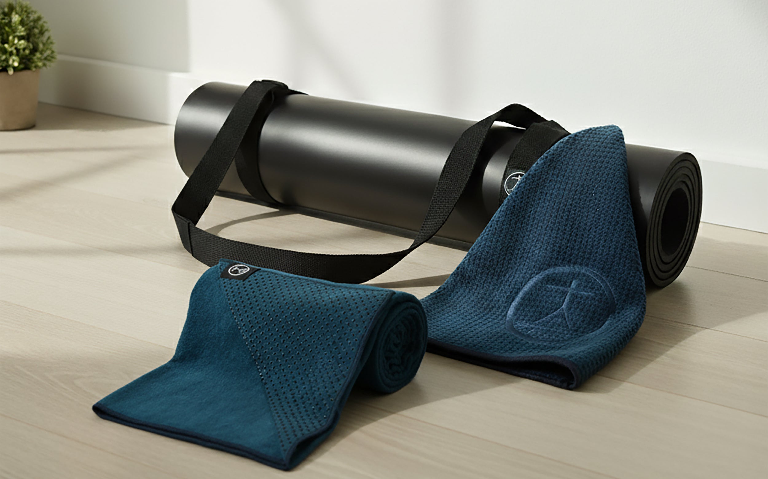 Women practicing yoga in a bright studio on extra-large, non-slip Tatago yoga mats for comfort, balance, and wellness.