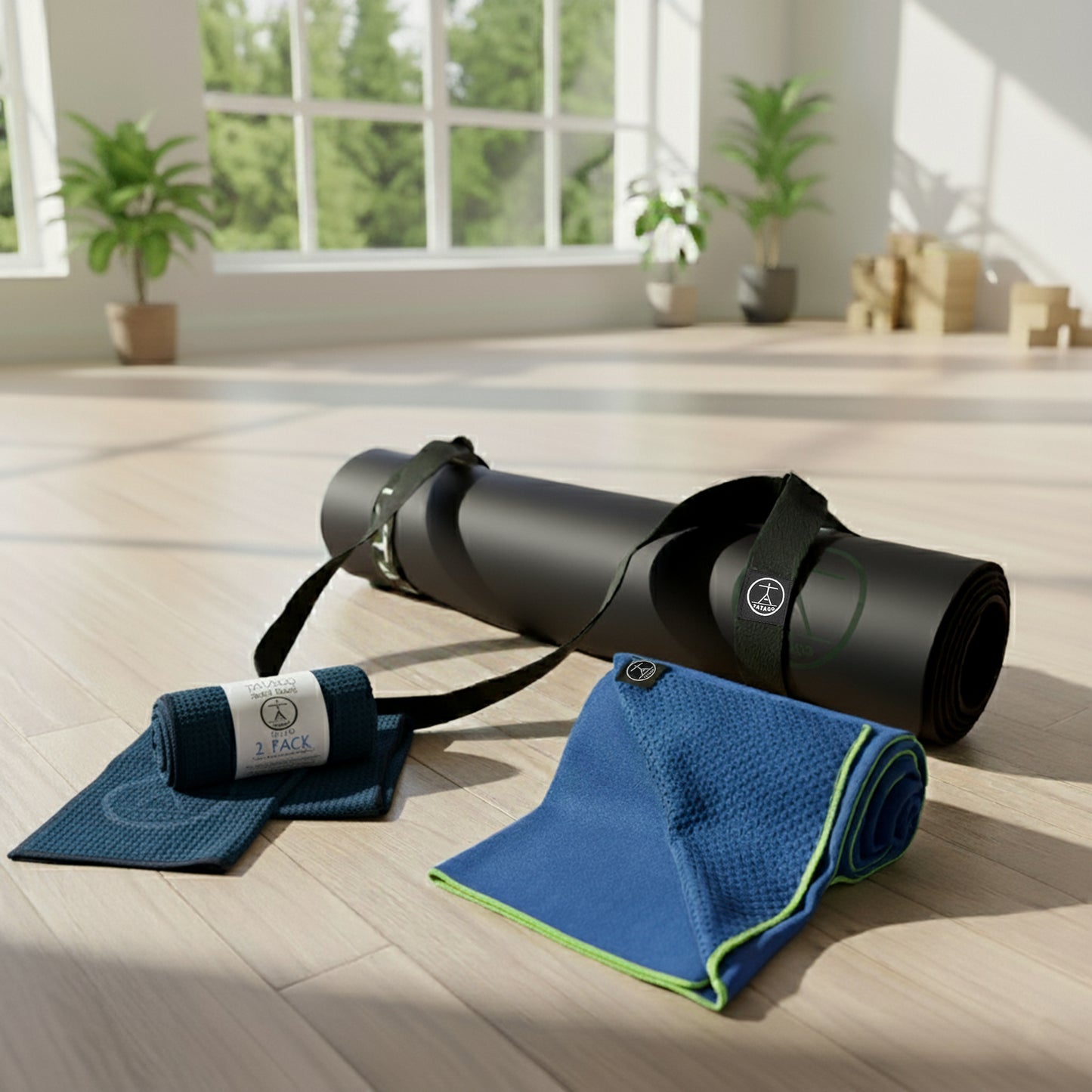 Extra large black yoga mat with blue hot yoga towel and sweat towel set with carry strap for Bikram hot yoga and Pilates.