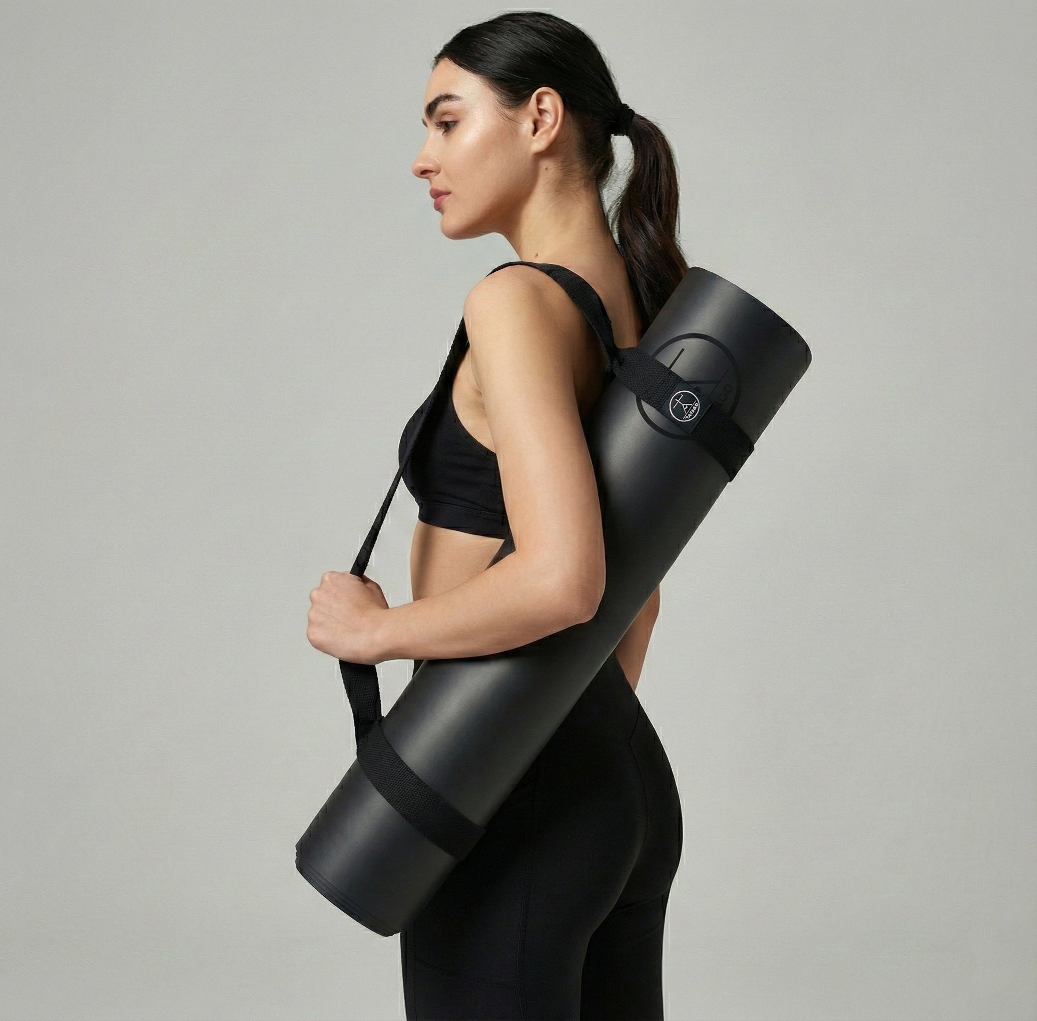 Woman using Yoga Mat Strap for carrying and yoga strap