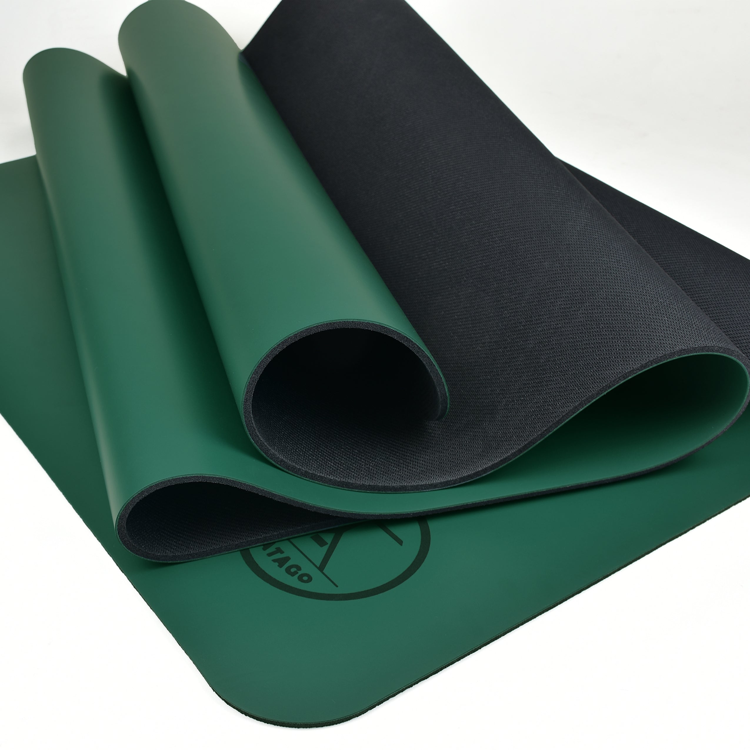 Natural rubber xl yoga mat shown rolled to display surface and rubber backing - Green