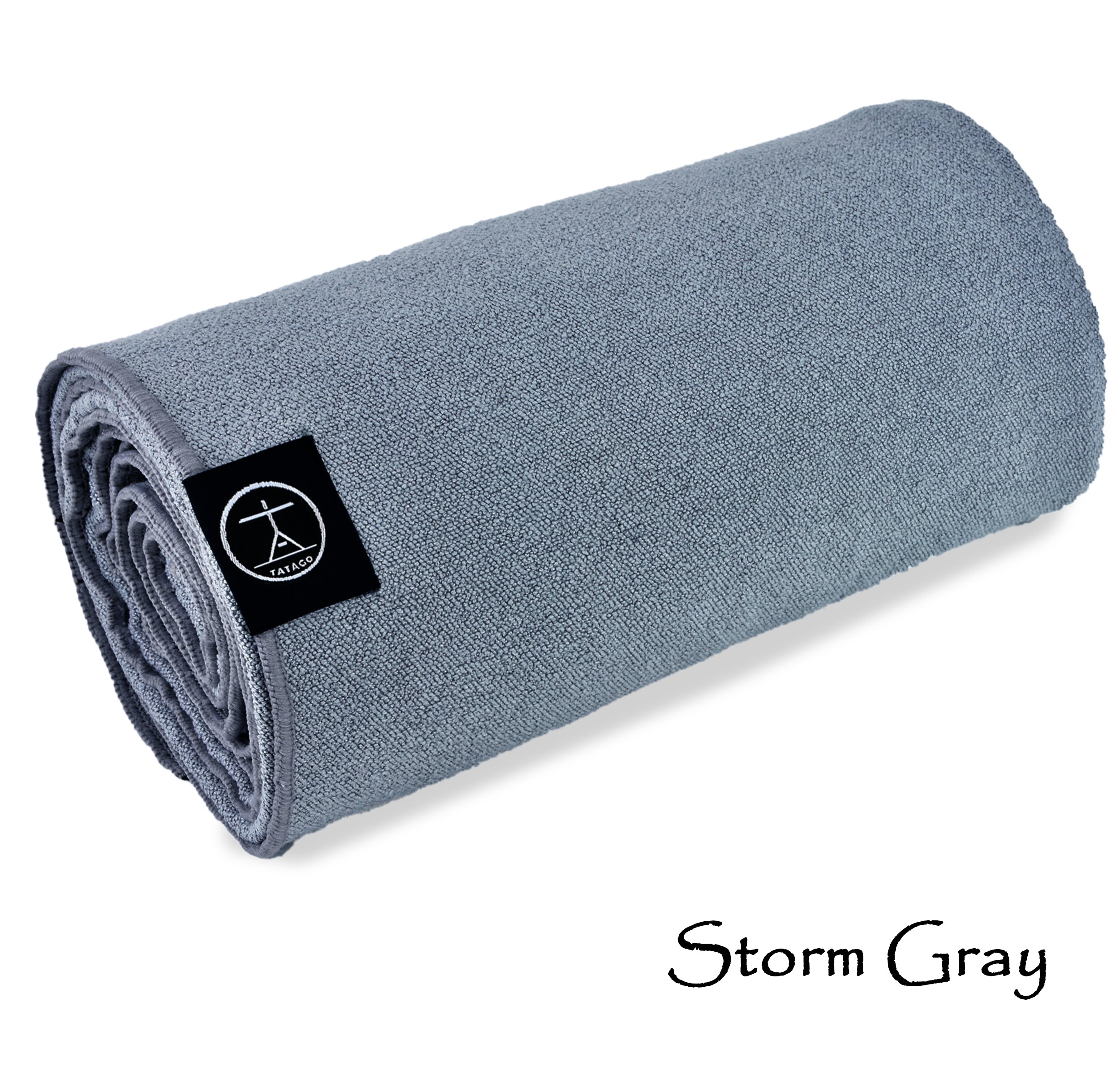 Gray microfiber yoga mat towel with silicone grip, rolled view for hot yoga and Pilates (Storm Gray)