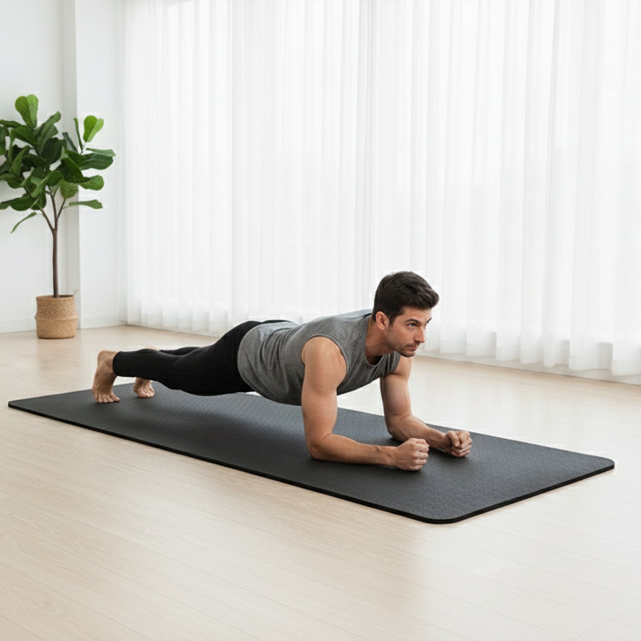 Man doing plank on 10 mm extra large workout mat thick non-slip yoga mat for tall people at home