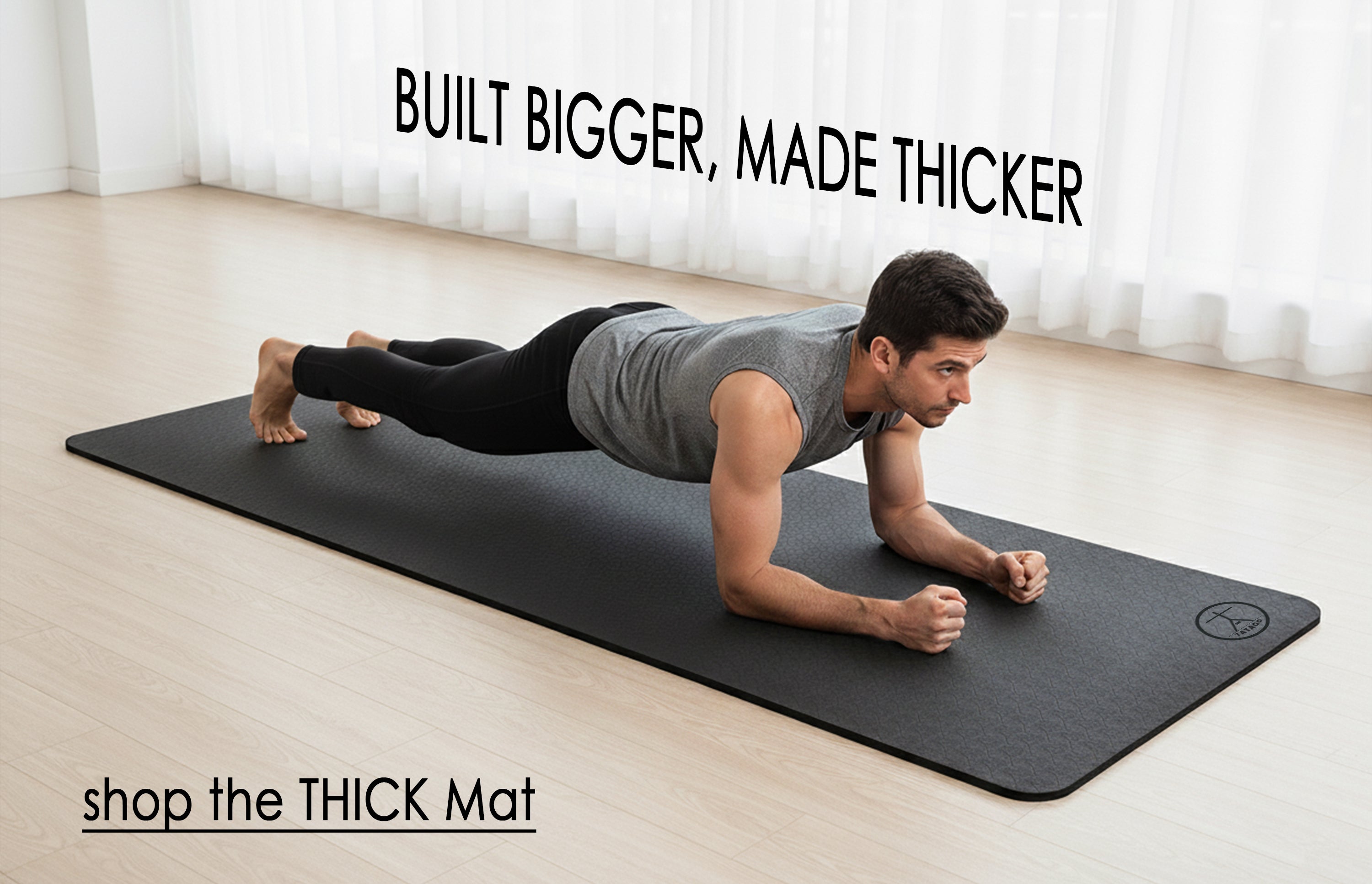 A extra large thick yoga mat with a man stretching in his home.