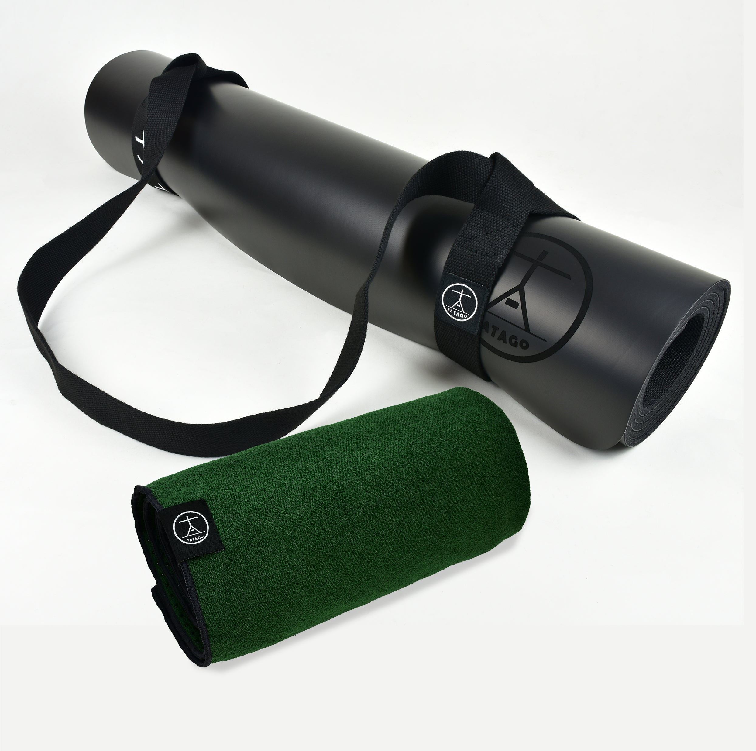 Extra large natural rubber yoga mat with rolled green hot yoga towel and carry strap for Bikram, Pilates, and sweaty sessions