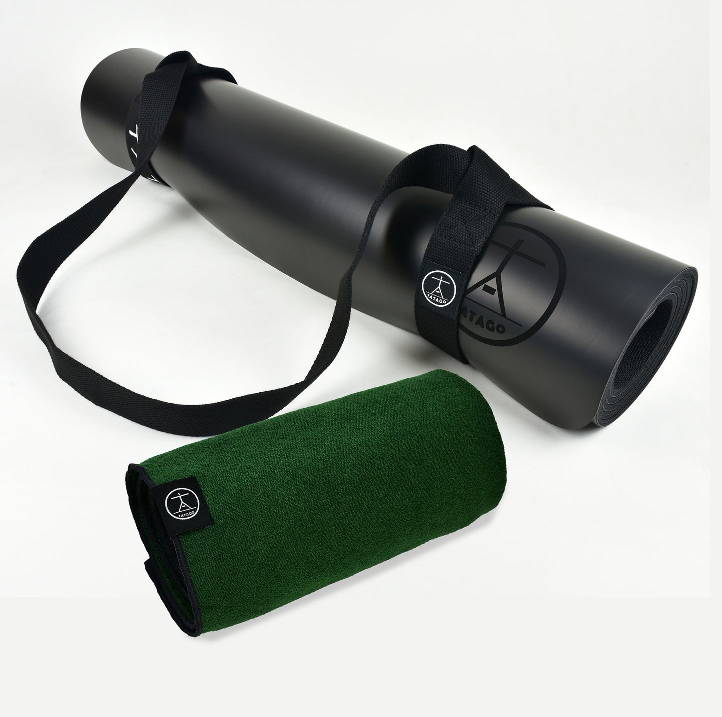 Extra large natural rubber yoga mat with rolled green hot yoga towel and carry strap for Bikram, Pilates, and sweaty sessions