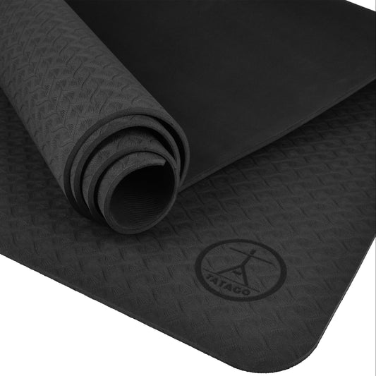 A black 6mm yoga mat thick with a non-slip surface, featuring the Tatago brand logo.
