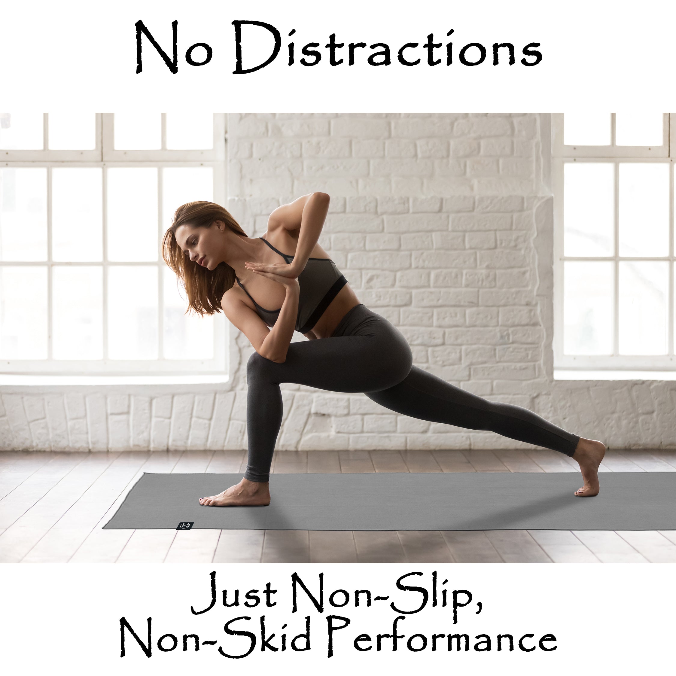 Woman practicing yoga on a non-slip rubber yoga mat during a hot yoga style flow, highlighting natural rubber yoga mat stability for heated yoga and Pilates.